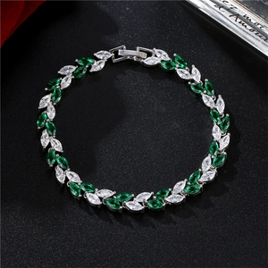 Macro detail of colorful marquise crystal leaf bracelet in green and white gems