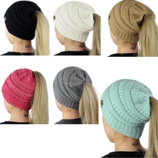 Six colors of knit ponytails beanies with leather labels shown on models from behind