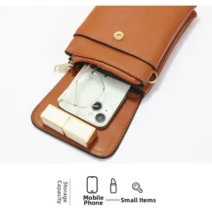 Brown leather crossbody bag interior showing storage for phone, lipstick and glasses
