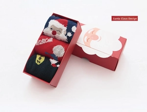 Three-pack Christmas cotton socks set featuring Santa Claus designs in a red gift box