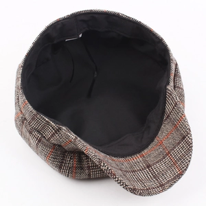 Classic vintage plaid beret hat with warm brown and orange checkered wool pattern