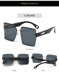 Vista detallada de gafas de sol cuadradas sin montura con bisagras de metal dorado elegante