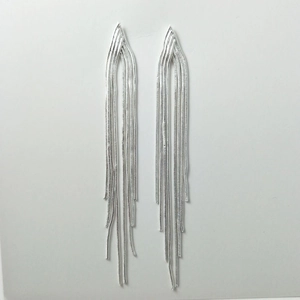 Detailed close-up of long silver metallic fringe earrings with cascading snake chains