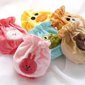 Close-up of soft plush drawstring bags featuring cute cartoon animal embroidery characters