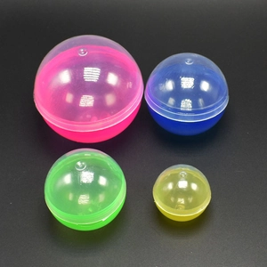 Detailed view of colorful transparent plastic vending capsules in pink blue green and yellow