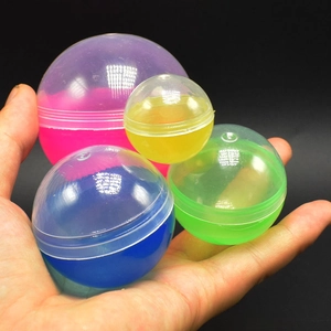 Colorful translucent round plastic capsules in pink yellow blue and green colors