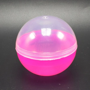 Detail of a transparent and hot pink plastic capsule shell with a secure snap closure