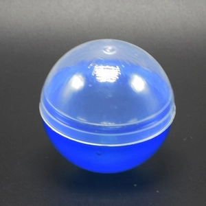 Detail of 50mm blue and transparent plastic vending capsule with secure snap closure