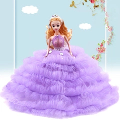 Detail of doll in layered purple frill dress with silver hair accessory for baby headband set