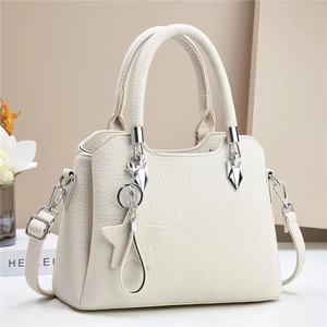 Chic white lychee leather bucket bag with silver hardware and star charm detail