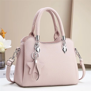 Pink lychee texture bucket bag with star pendant and adjustable shoulder strap for women