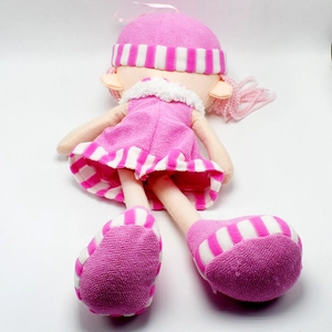 Detail of pink knitted plush doll with long legs and striped fabric on white background