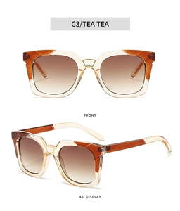 Detail view of square frame sunglasses with tea gradient lenses and metal hardware accents