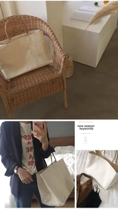 Close-up of minimalist cream canvas tote bag with brown handles in various display angles