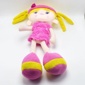 Detailed close-up of yellow and pink pastoral plush doll with sequins and braids