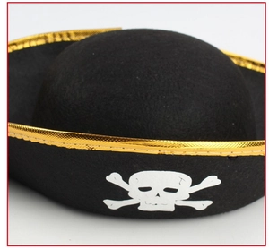 Close-up of black felt pirate hat with golden metallic trim and skull crossbones print