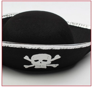 Detail of black felt pirate hat with silver trim and white skull and crossbones logo