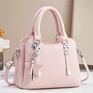 Pink lychee grain leather handbag for women featuring silver hardware and star pendant