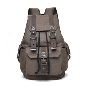 Vintage dark brown canvas backpack with leather straps and large capacity for travel