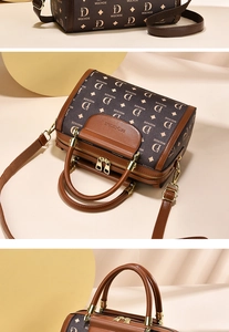 Close-up of golden hardware and vintage brown monogram pattern on Boston bag