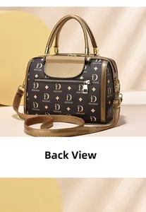 Detail view of the back of a Boston bag showing smooth metal zipper pocket and monogram pattern