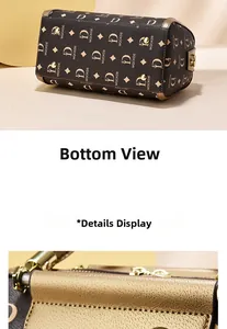 Detail view of the barrel bag bottom with gold studs and monogram leather texture