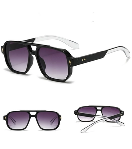 Detail view of square double bridge sunglasses with purple gradient lenses and gold accents