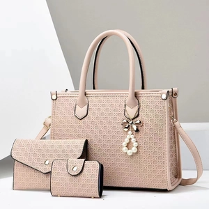 Nude pink three-piece handbag set with woven texture and pearl bow charm detail