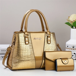 Detailed set of three golden tote bags including matching wallet and a compact card holder