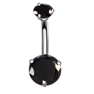 Detail of a curved stainless steel belly ring with large black multifaceted zircons