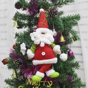 Christmas Santa Claus plush hanging ornament with sequins on a decorated Christmas tree