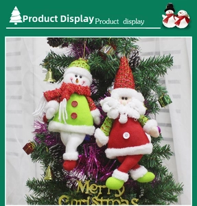 Detail of plush Santa and Snowman ornaments with sequins on a decorated Christmas tree