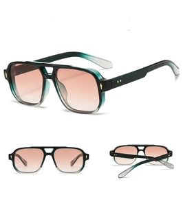Macro detail of square double bridge sunglasses with green acetate frame and orange lenses
