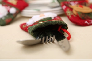 Christmas snowman glove cutlery holder featuring Santa and reindeer felt ornaments