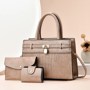 Detailed set of three khaki faux leather bags featuring elegant crocodile texture and gold hardware