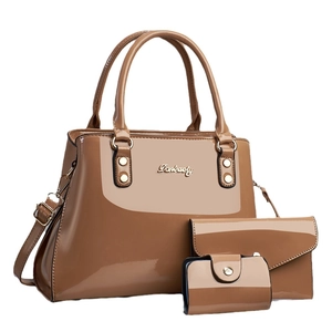 Three-piece brown patent leather handbag set including tote, clutch and card holder