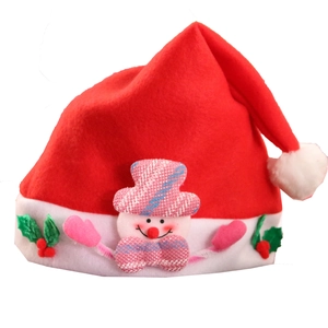 Detail of red felt Christmas hat with cute snowman applique and holly berry decoration