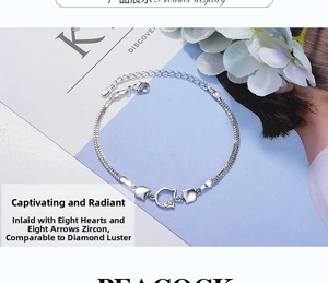 Macro detail of silver double-layer bracelet featuring zircon-encrusted cat charms