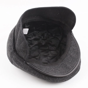 Deep grey herringbone wool flat cap with warm black quilted lining for men in winter