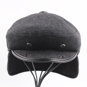 Classic men's winter woolen flat cap with warm ear flaps and grey herringbone pattern