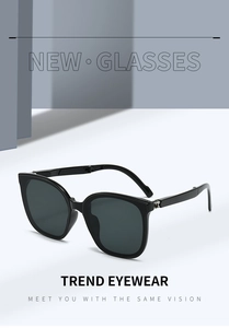 Close-up of foldable black sunglasses featuring durable silver metal hinges and sleek design