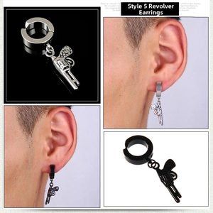 Detailed view of punk-style stainless steel revolver pistol charm earrings in silver and black