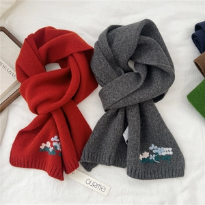 Knitted wool scarf with floral embroidery in dark red and charcoal gray colors