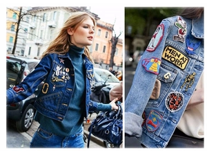 Nahaufnahme von taktischen Stick-Patches auf einer dunkelblauen Jeansjacke für Herren
