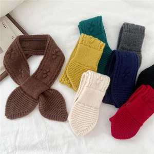 Knitted wool scarf collection with cross-knot design in multiple warm winter colors