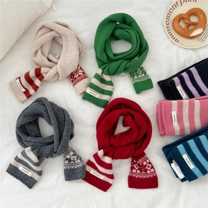 Striped wool knit scarf in multi-colors with snowflakes pattern on white background