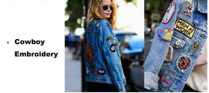 Detailaufnahme von Vintage-Stickereien auf einer blauen Jeansjacke im Streetwear-Stil