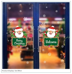 Detail of Christmas Santa and snowflake wall stickers on glass double doors for shop decor