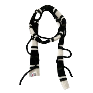 Striped knit skinny scarf for women featuring monochrome patterns and long decorative ropes