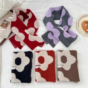 Multiple styles of 100% wool knitted flower scarves in various warm color combinations